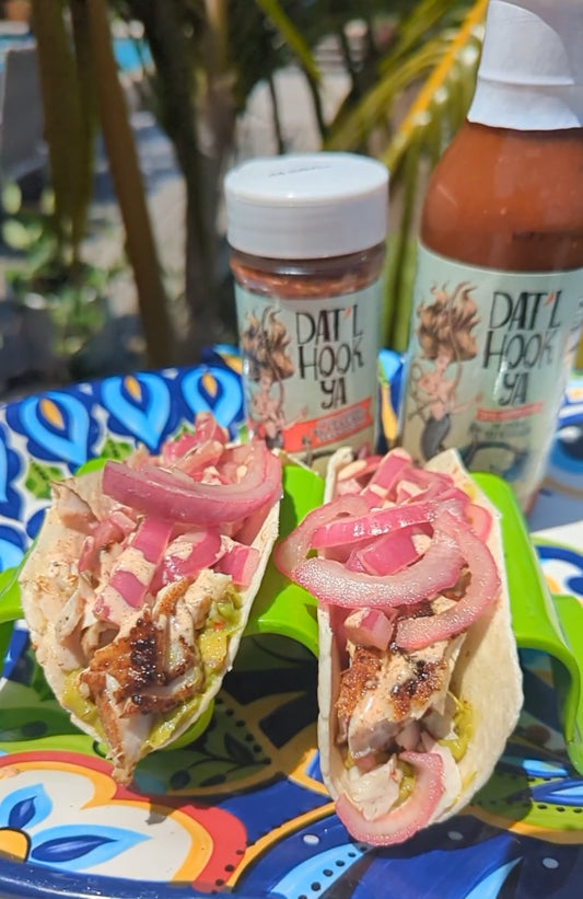 Dat’l Hook Ya Pickled Red Onion Blackened Fish Taco with a Spicy Lime Crema sauce