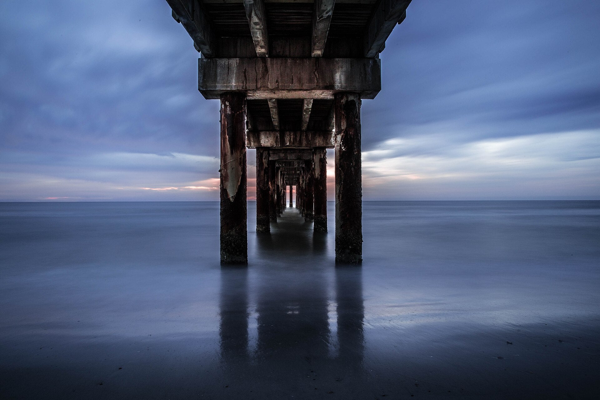 Sunrise through the pilings of the St. Augustine Beach pier