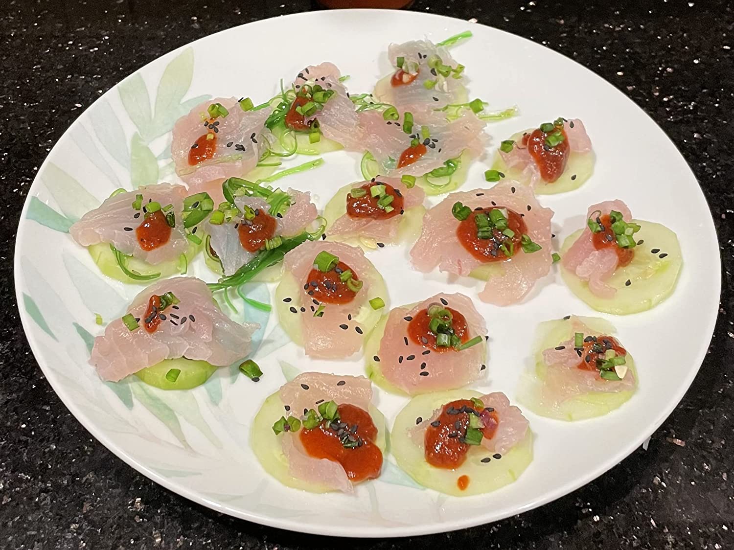 Datil pepper sashimi cucumber discs featuring Datil Hook Ya